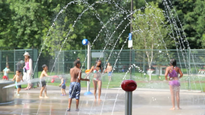 TORONTO, JULY 21 - Children play in splash park to beat record hot temperatures of 44 C, July 21, 2010 Toronto, Ontario Canada