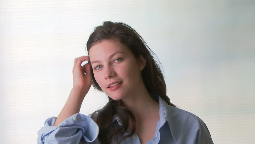 Portrait of young sensual woman wearing man's shirt