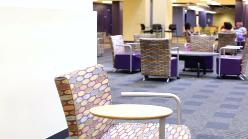 Student sitting down in University Lounge