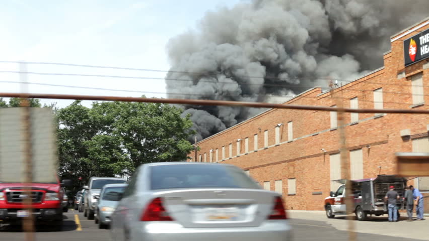 DAYTON, OH - THURSDAY 20: Driving by smoke cloud from fire in sky started at local scrap yard on Thursday May 20, 2010 in Dayton, Ohio.
