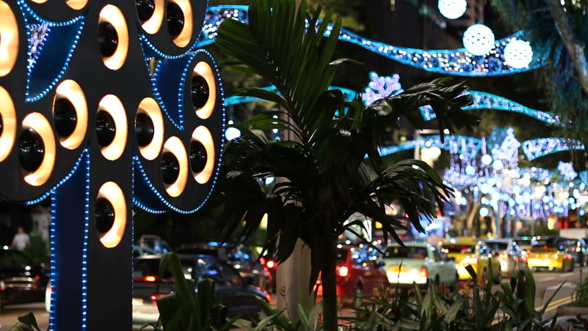Fancy Christmas "tree" at the sidewalk of Singapore's Orchard Road, colorfully decorated for Christmas.   (1080p, C. 7D).