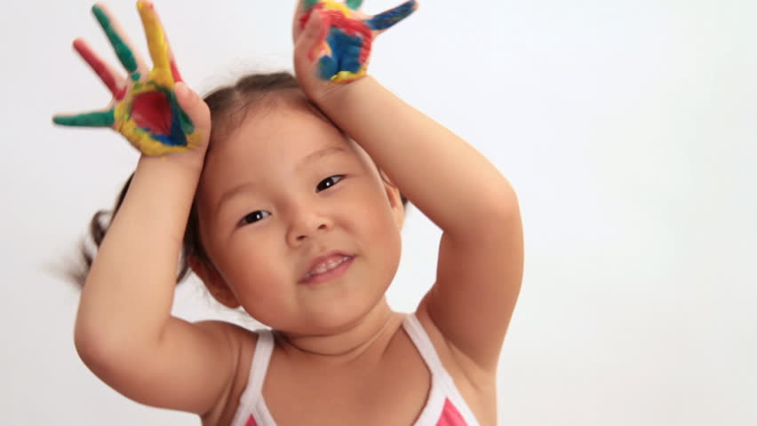 Portrait of a little girl with painted palms