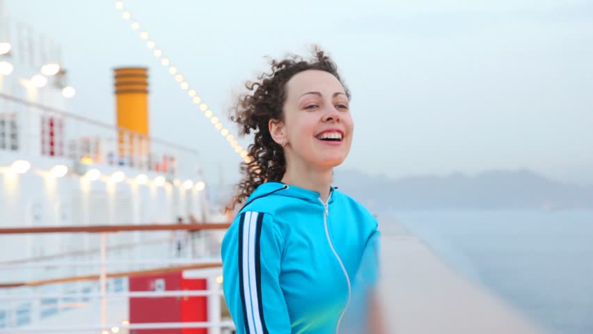 happy young woman on cruise ship