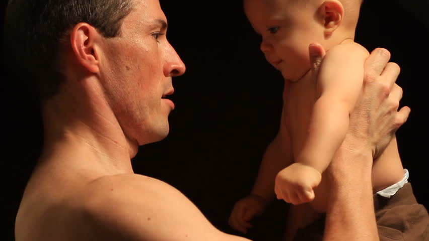 Daddy and Baby against Black Background Series 3