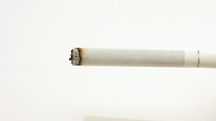 Cigarette burning and smoking time lapse, isolated on white. 