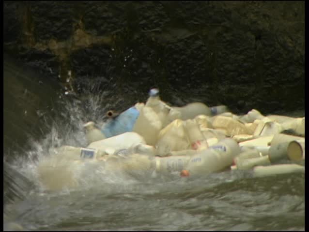 Plastic waste floating in a canal