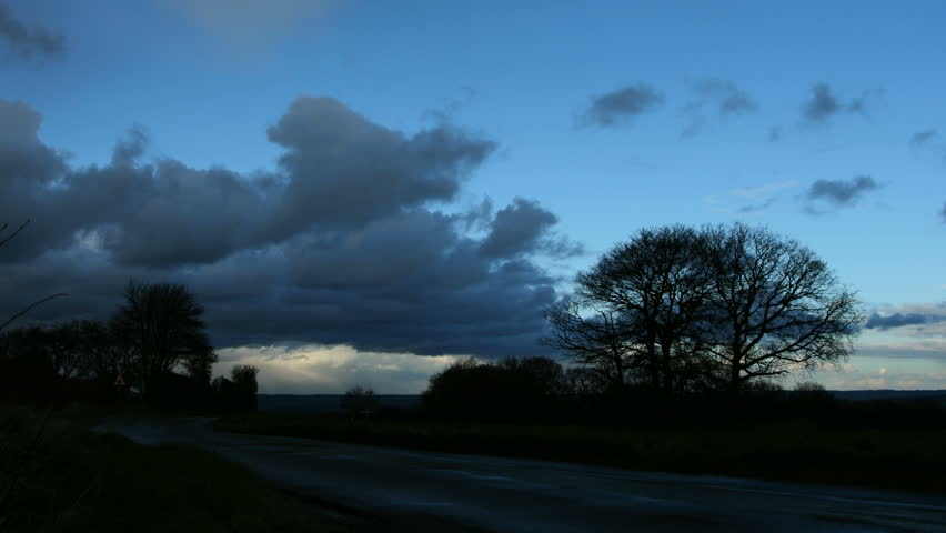 time lapse of a glorious rainbow forming during rainfall in the countryside