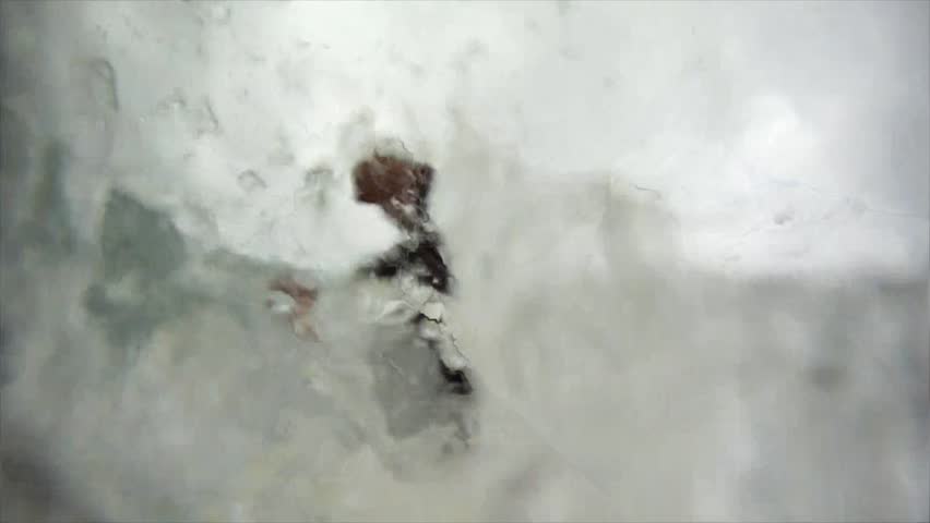 Surfer gets a barrel on a big wave.