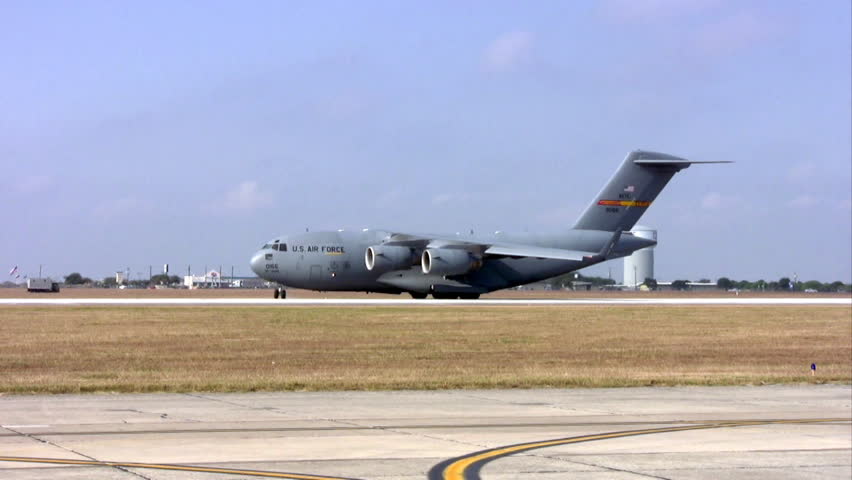 Video of C-17 Globemaster III aircraft taxi on runway and turning at Randolph AFB Texas. Air Force cargo transport aircraft built by Boeing Aircraft. 
