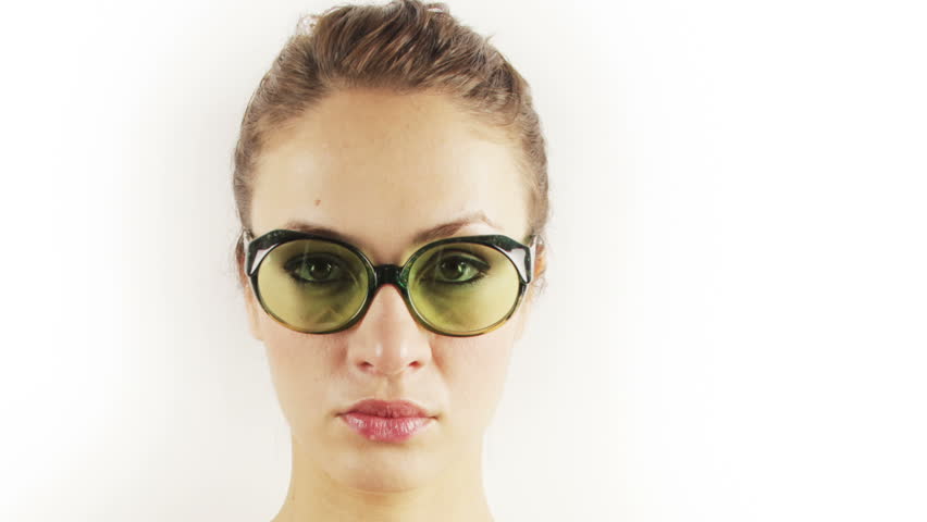 stop-motion of a pretty woman wearing different retro sunglasses
