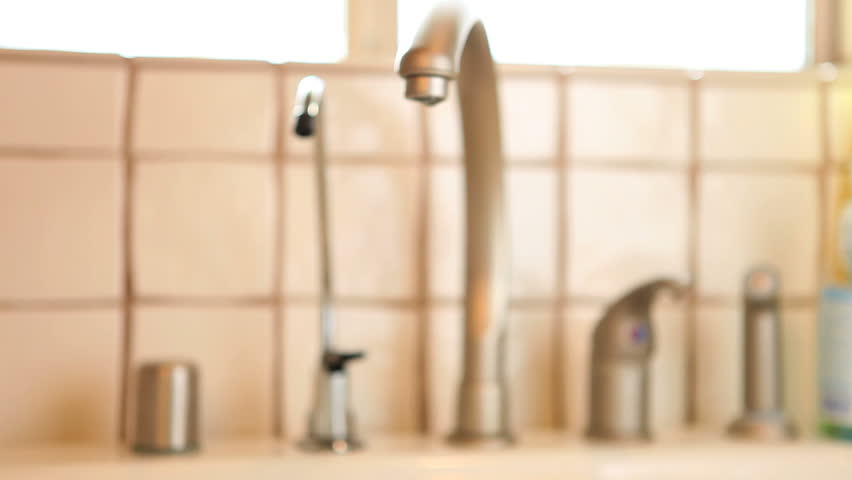 woman washing hands with soap