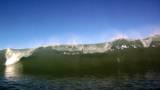 A series of big, ocean waves break on the camera at Waimea Bay in Hawaii.  Filmed in 720p High Definition.