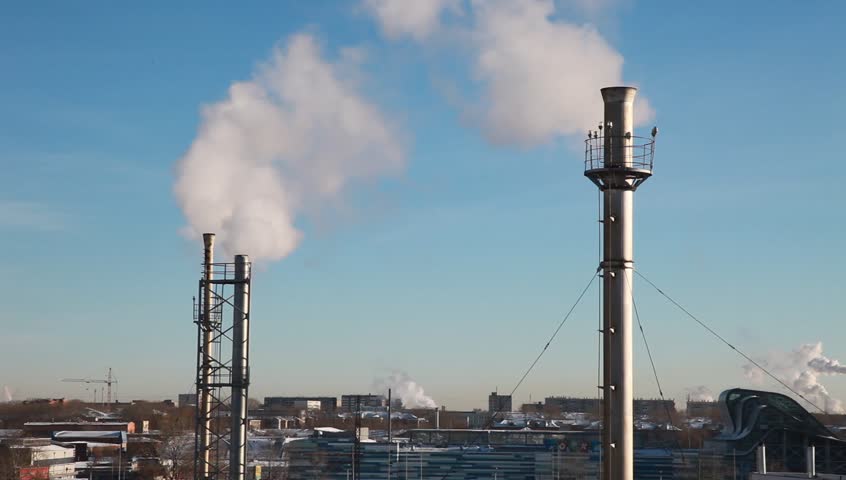 Chimneys releasing a fantastic amount of smoke. Ideal image to highlight climate change, global warming and greenhouse issues.