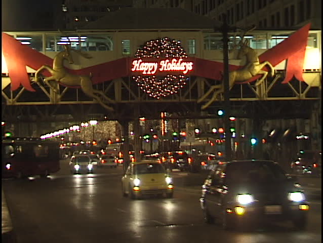 chicago happy holidays sign over city street