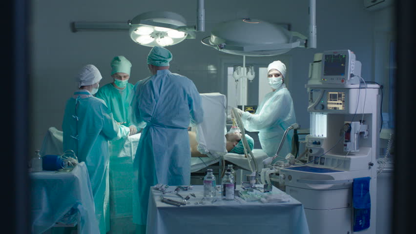 There Are Two Surgeons And Two Nurses In The Operating Room During The