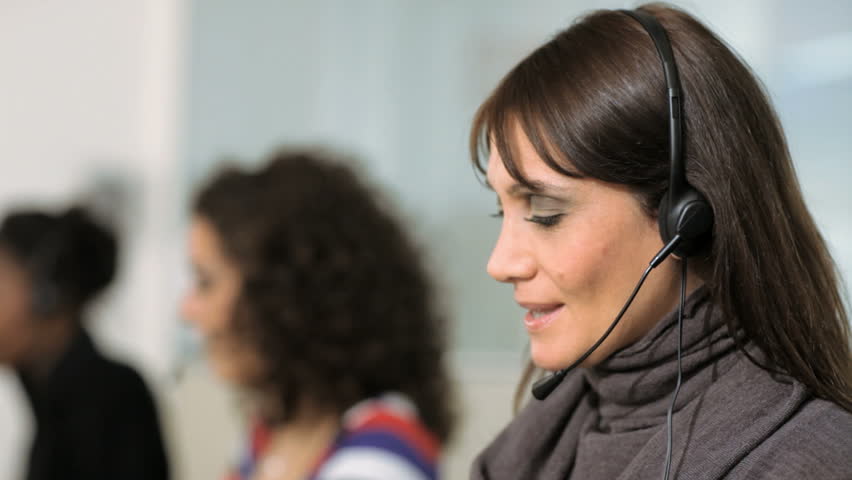 multiethnic group of female customer service representatives talking on the phone 