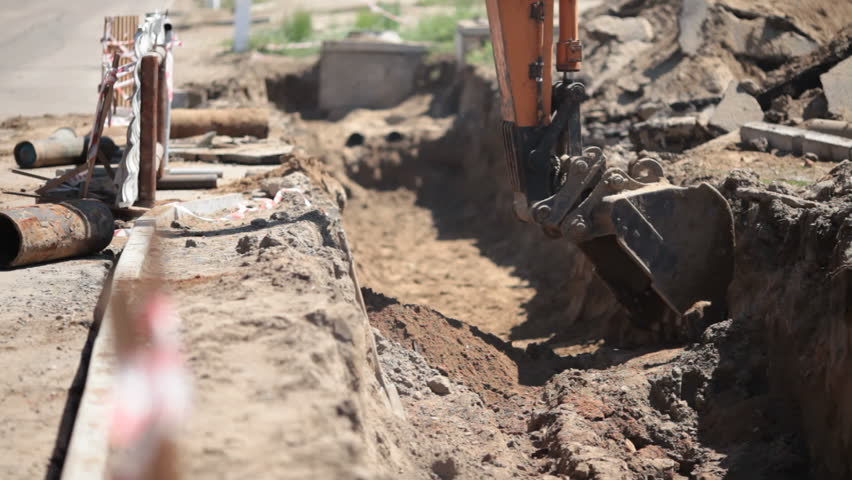 Excavator digs the earth