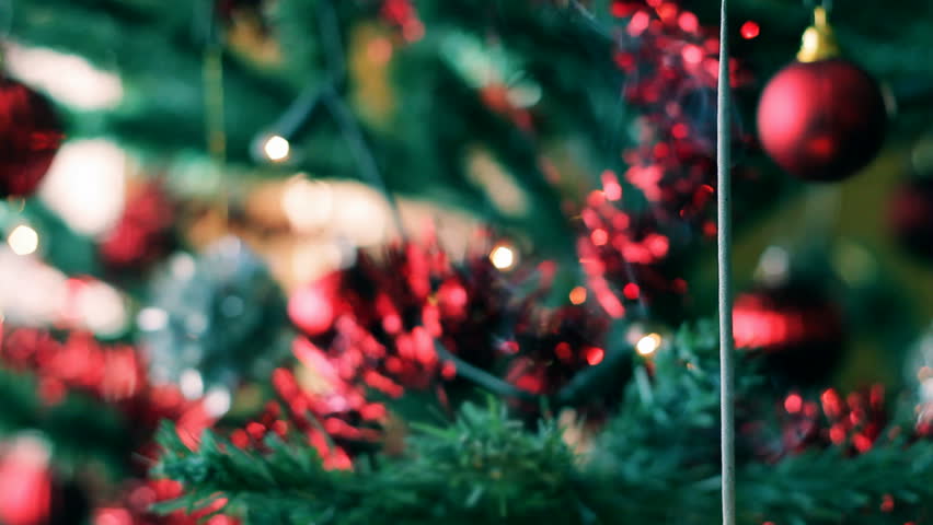 Christmas tree with color balls and burning sparkler