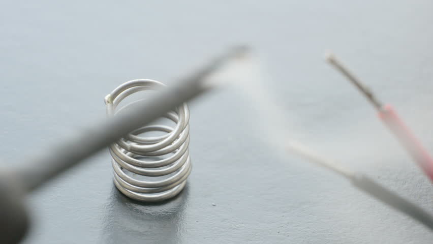 Stock Video Clip of Soldering tin wire spring rotating on white ...