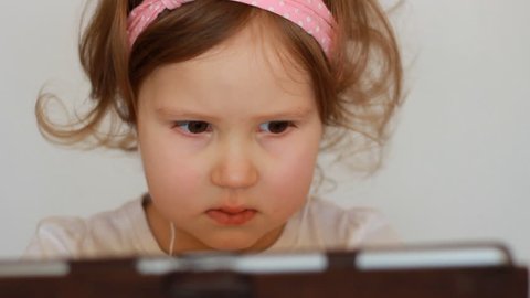 A Cute Little Girl Looks Stock Footage Video 100 Royalty Free