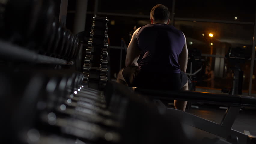 Tired Bodybuilder Sits On Bench Stock Footage Video 100 Royalty