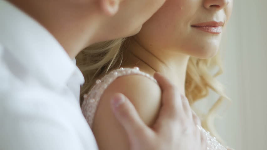 Guy Kisses His Beloved Pregnant Woman Standing At The Window Guy Kisses His Beloved Pregnant Woman Standing At The Window
