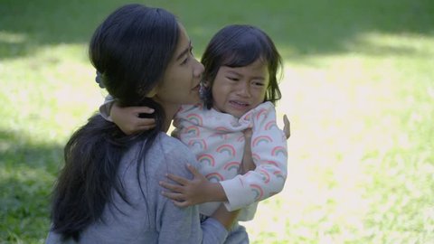 Toddler Pee Porn - Portrait of asian mother telling her upset daughter to stop crying