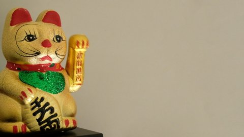 A Maneki Neko Waving Cat Meaning Beckoning Cat Figurine Swinging It S Arm To Beckon This Figurine Is Believed To Bring Good Luck To The Owner Some Westerners Believe The Cat Is Waving Instead