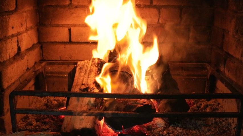 4k00 22burning Firewood Are Moving By A Fire Iron In Outdoor Open