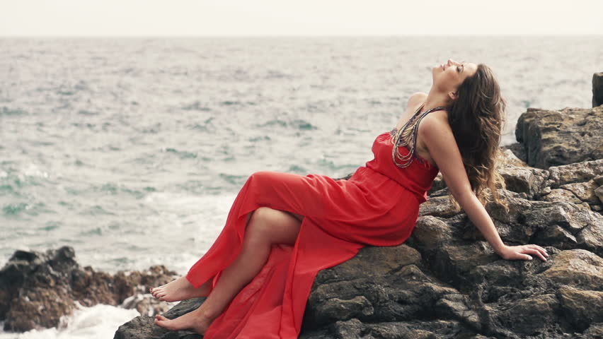 Woman In The Mountains. Beautiful Girl Fashion Model Sitting On A Rock ...