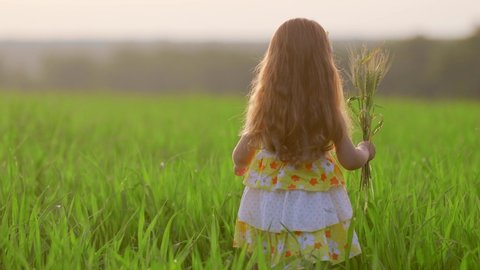Natural Nude Hippie Girl - Girl runs away on a green field, blue sky, clouds