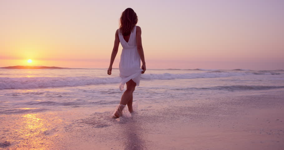 Girl in a white dress walking on the beach images Girl in a white dress walking on the beach images