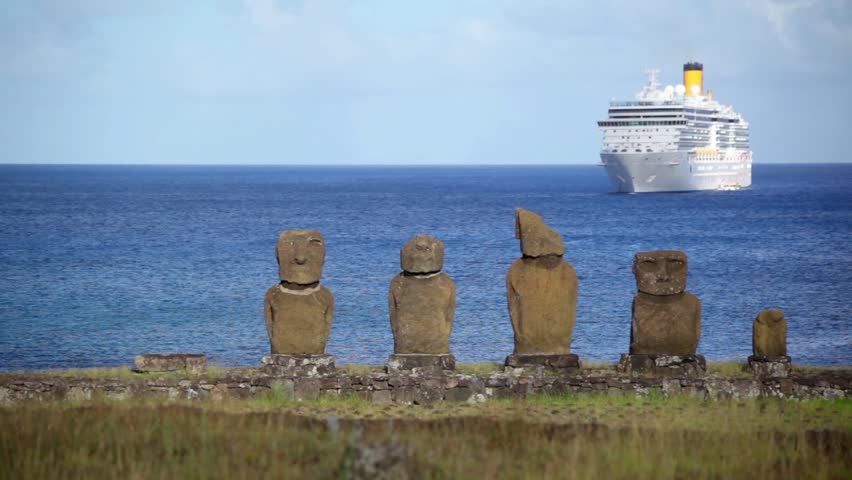 Cruise Ship Floats Off Coast Of Easter Island In View Of A Line Of Moai Cruise Ship Floats Off Coast Of Easter Island In View Of A Line Of Moai