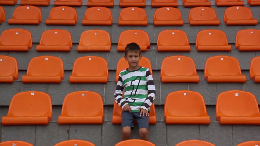 The boy at the stadium. Watch Match Team lose.