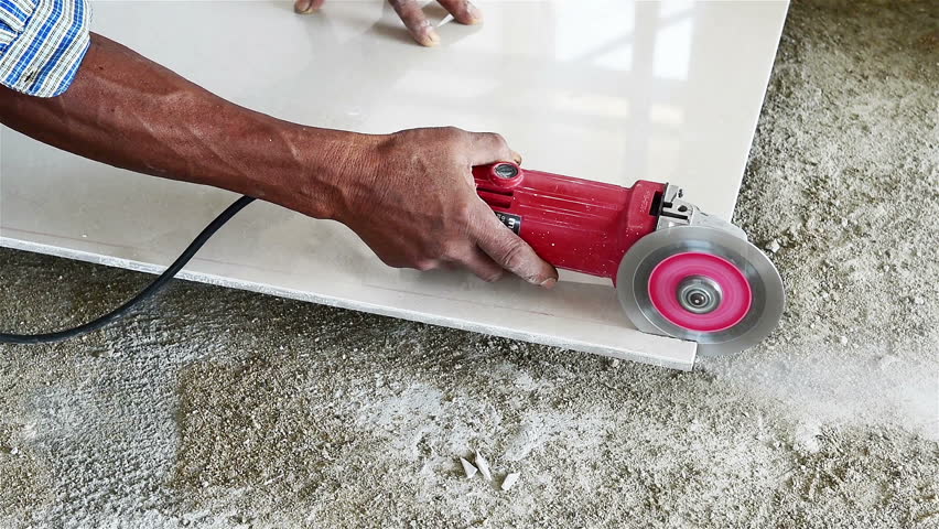 Craftsman Cutting The Tile By Circular Saw Stock Footage Video 2564864 ...