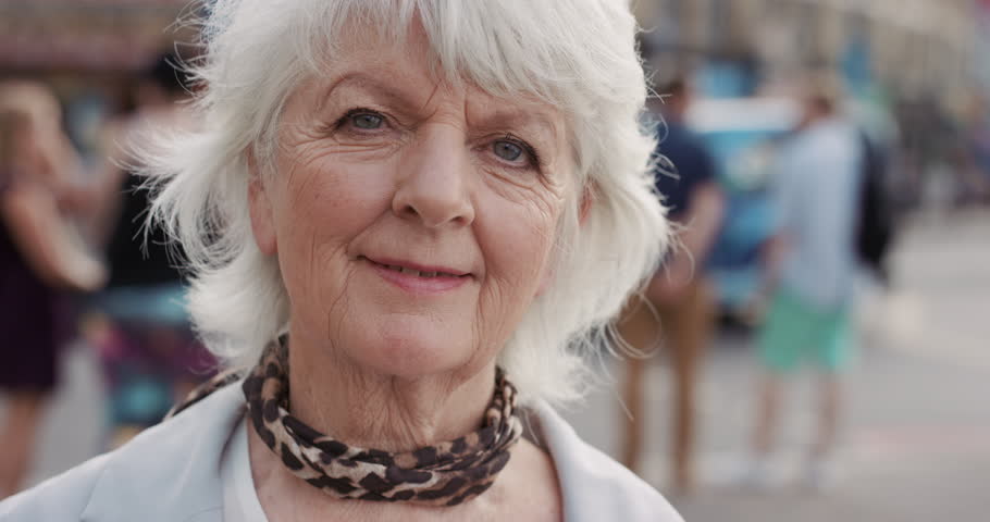 Slow Motion Portrait Of Happy Mature Old Woman Smiling In City Real