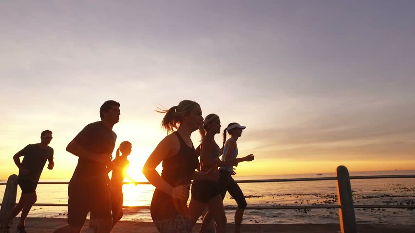 Group Of Five Teenage Girls Having Fun The Beach At Sunset