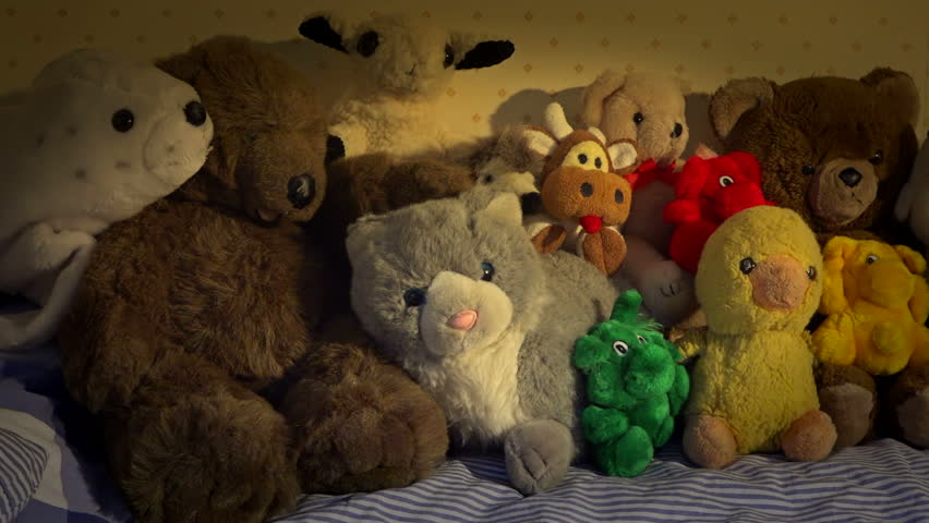 stuffed animals on bed