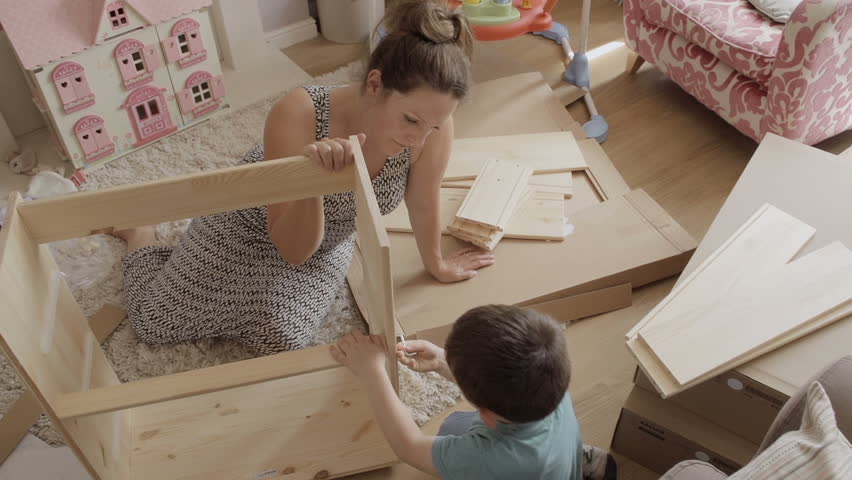 Hd00 11mother And Son Assembling Flat Pack Draws