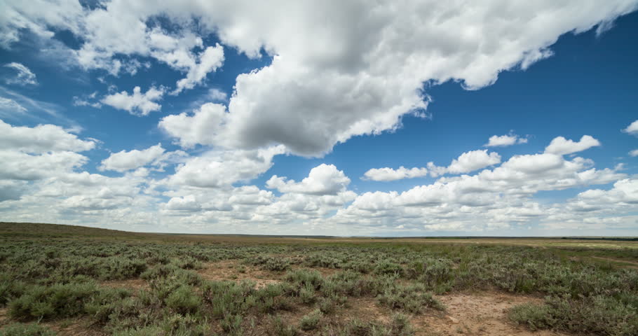 Time Lapse Of White Puffy Clouds Rolling Directly Towards Camera Over ...