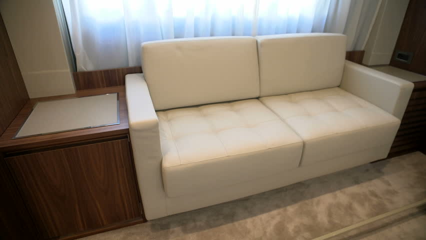 White Leather Sofa In Main Cabin On Luxury Yacht