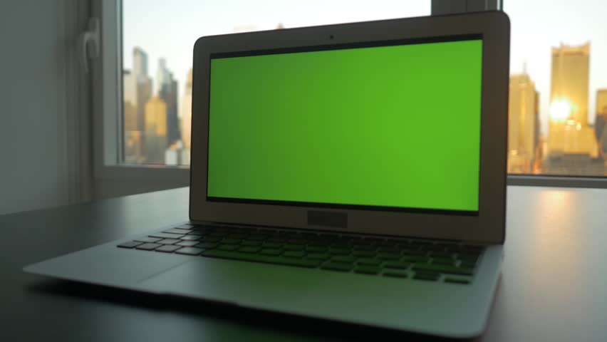 Laptop Computer With Isolated Green Screen Background. Modern City ...