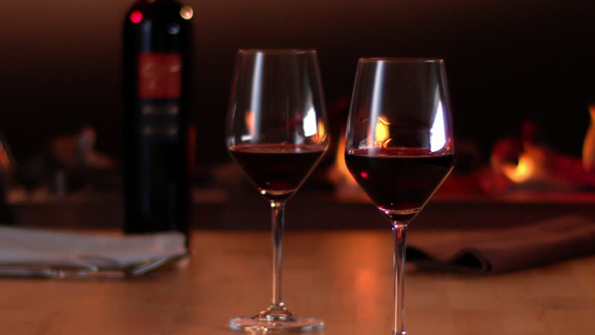 Two elegant glasses of red wine in front of a… - Royalty Free Video