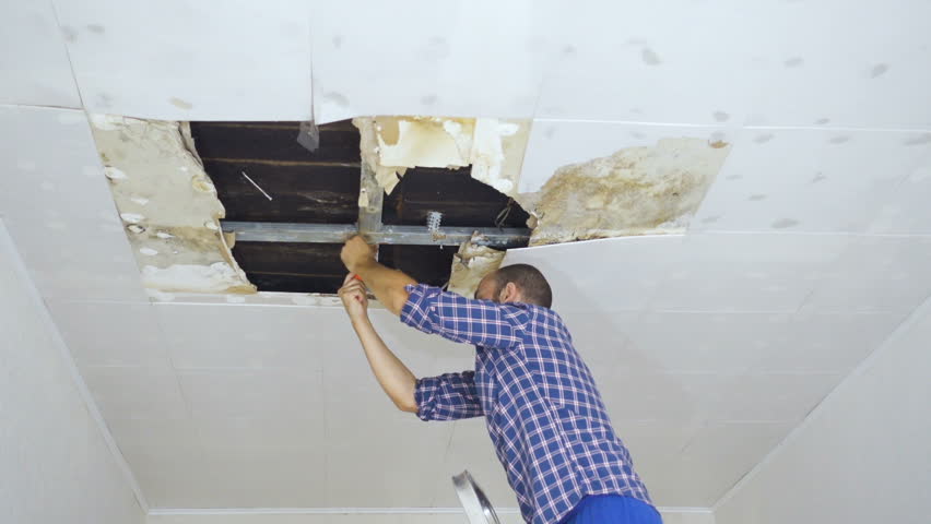 Man Repairing Collapsed Ceiling Ceiling Stock Footage Video 100 Royalty Free 19069900 Shutterstock