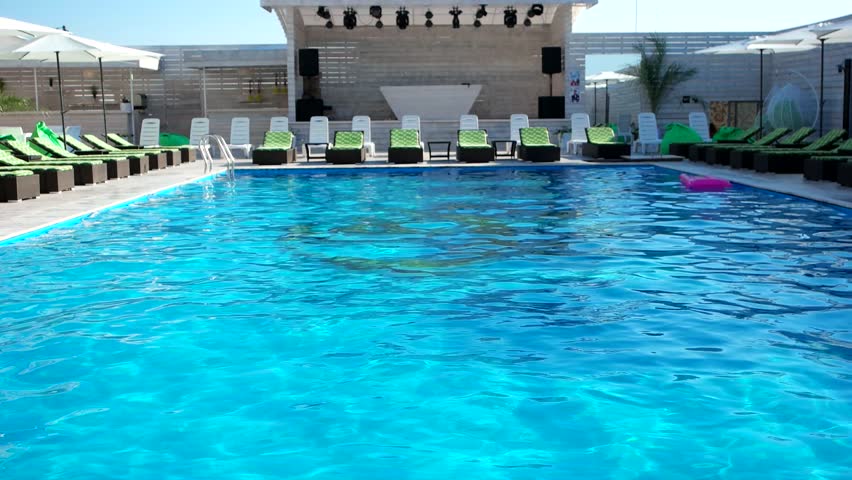 Swimming Pool Background swimming pool. hotel, summer, vacation, sport, waves, umbrella Swimming Pool Background swimming pool. hotel, summer, vacation, sport, waves, umbrella
