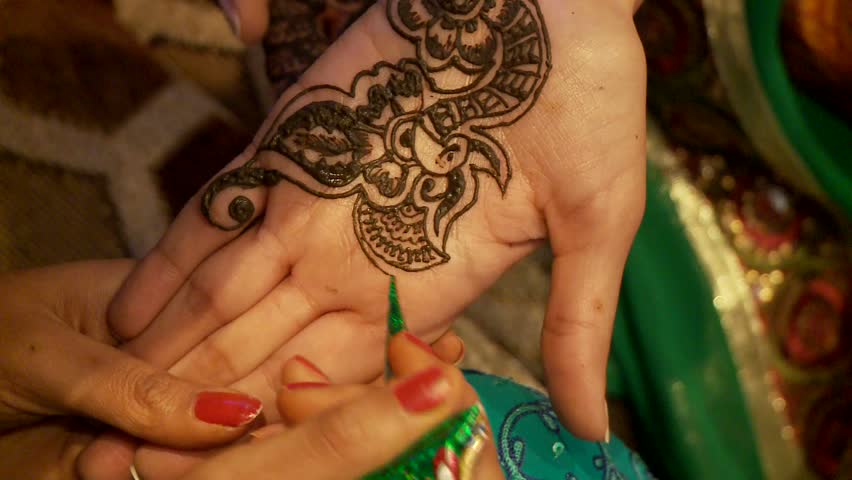 a tattoo master mehendi artist makes drawing of henna a tattoo master mehendi artist makes drawing of henna