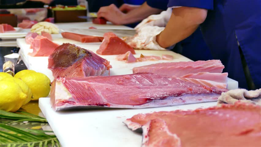 Restaurant Kitchen Video chef cook hands cutting with knife tuna fish fillet 4k video in Restaurant Kitchen Video chef cook hands cutting with knife tuna fish fillet 4k video in