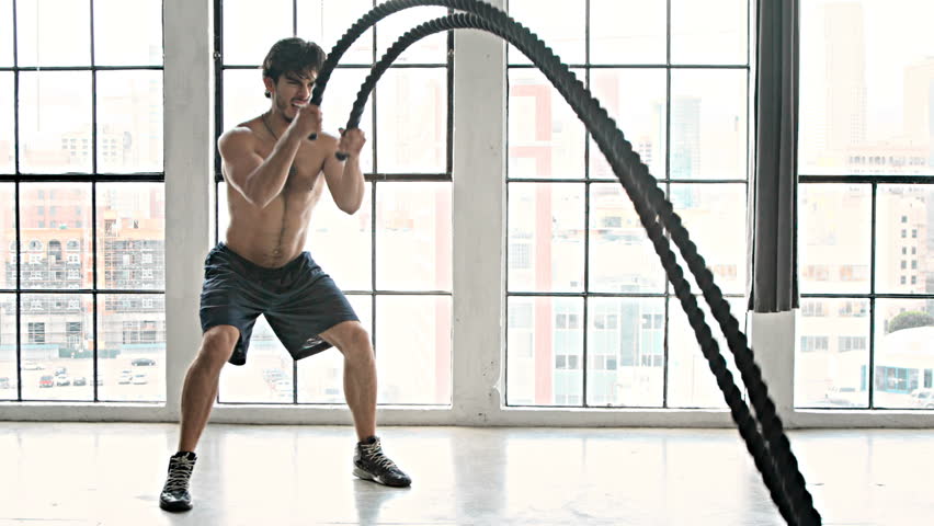 hd00 10athletic male working out using battle ropes high intensityathletic male working out using battle ropes high intensity interval training slow motion