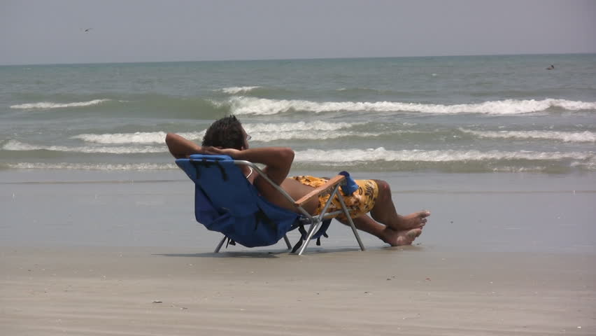Guy In Beach Chair Stock Footage Video 100 Royalty Free 202030 Guy In Beach Chair Stock Footage Video 100 Royalty Free 202030 Shutterstock