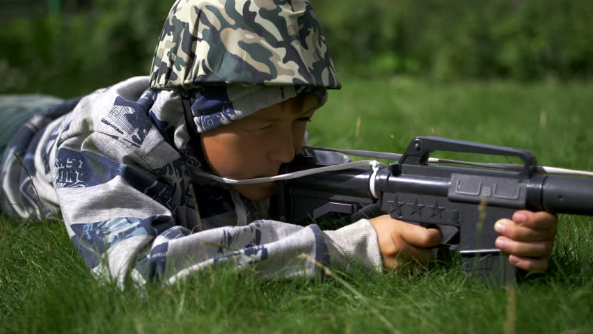 kid pointing gun stock photo